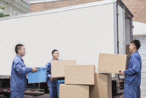 Removal team loading furniture for a London home move