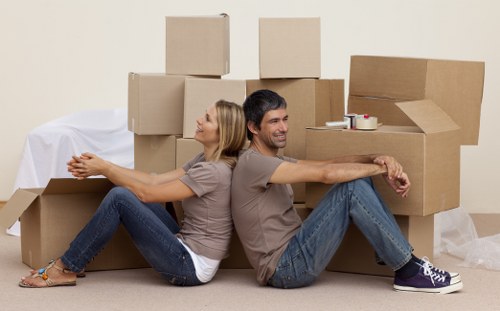 Movers carrying items through a Londonremoval property staircase