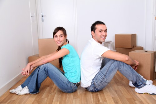 Professional movers planning a relocation in a London residential street